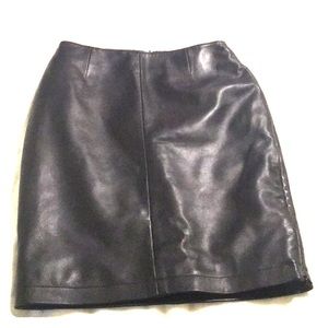 Black leather skirt..super tight,high waisted. Hot